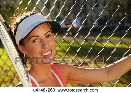 Stock Image - Close up of smiling tennis player. Fotosearch