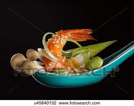 Stock Image - Close up of spoonful of food. Fotosearch