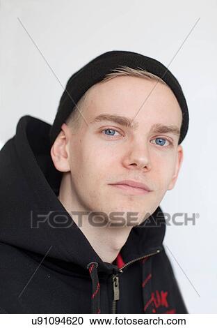 Stock Image - Close up of teenage boy's smiling face. Fotosearch