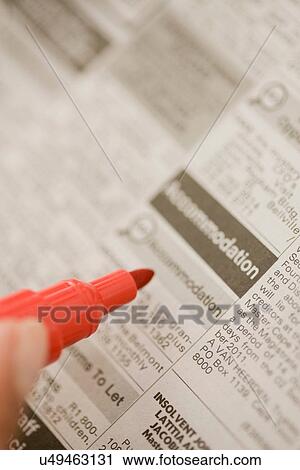 Close up of woman circling ads View Large Photo Image Stock Image - Close up of woman circling ads. Fotosearch