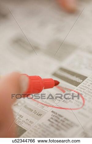 Close up of woman circling ads View Large Photo Image Stock Photograph - Close up of woman circling ads. Fotosearch