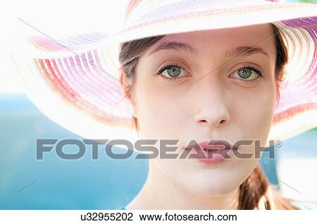 Close up of woman wearing colorful hat View Large Photo Image Stock Image - Close up of woman wearing colorful hat. Fotosearch
