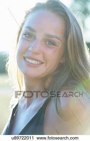 Stock Image - Close up of woman's smiling face. Fotosearch