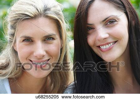 Close up of women's smiling faces View Large Photo Image Stock Photography - Close up of women's smiling faces. Fotosearch