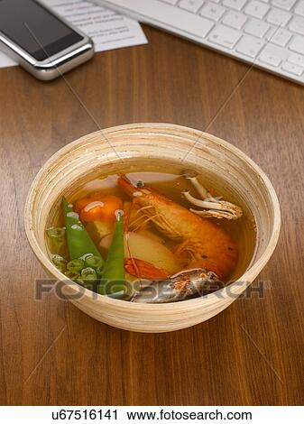 Closed up of bowl of soup on desk View Large Photo Image Stock Image - Closed up of bowl of soup on desk. Fotosearch