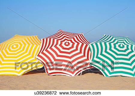 Colorful umbrellas on beach View Large Photo Image Stock Image - Colorful umbrellas on beach. Fotosearch
