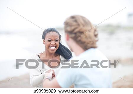 Stock Photo - Couple dancing on beach. Fotosearch