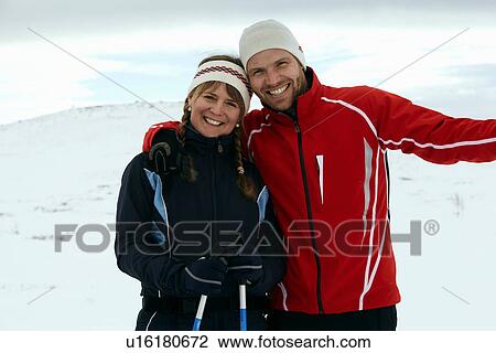 Couple hugging on snowy mountain View Large Photo Image Stock Image - Couple hugging on snowy mountain. Fotosearch