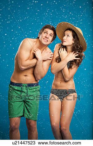 Couple in swimsuits shivering in snow View Large Photo Image Stock Image - Couple in swimsuits shivering in snow. Fotosearch