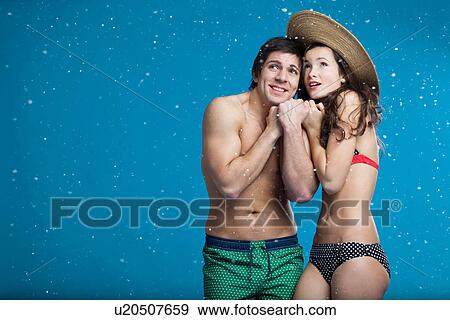 Couple in swimsuits shivering in snow View Large Photo Image Stock Photo - Couple in swimsuits shivering in snow. Fotosearch