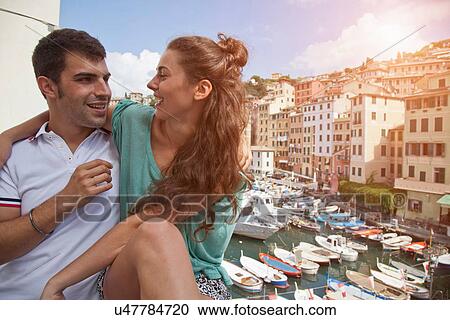 Couple on vacation admiring scenery View Large Photo Image Stock Image - Couple on vacation admiring scenery. Fotosearch