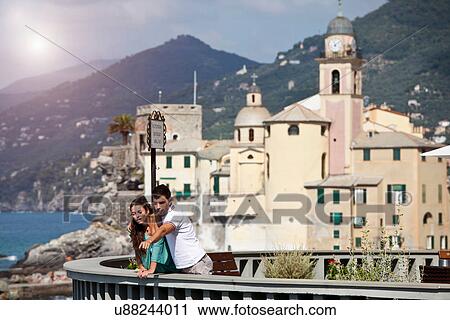 Stock Image - Couple on vacation admiring scenery. Fotosearch