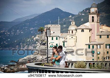Couple on vacation admiring scenery View Large Photo Image Stock Photo - Couple on vacation admiring scenery. Fotosearch