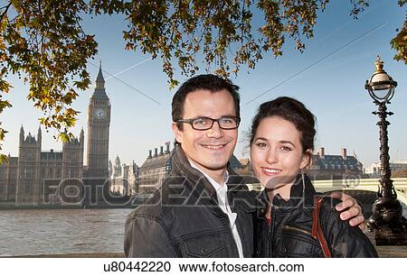 Stock Image - Couple outside House of Parliament. Fotosearch