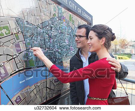Couple reading London city map View Large Photo Image Picture - Couple reading London city map. Fotosearch