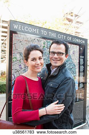 Couple standing by map of London View Large Photo Image Stock Image - Couple standing by map of London. Fotosearch