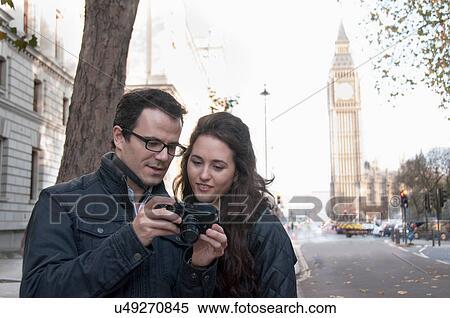 Couple taking pictures in London View Large Photo Image Stock Photography - Couple taking pictures in London. Fotosearch