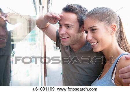 Stock Photo - Couple window shopping together. Fotosearch