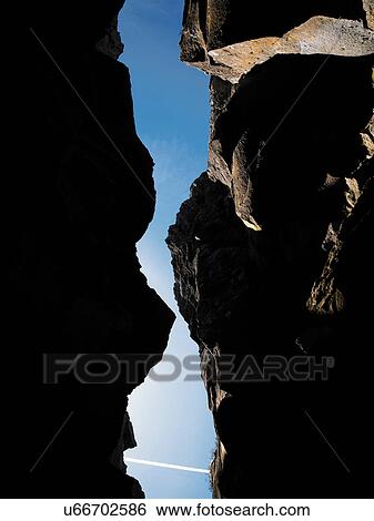 Stock Photograph - Crevice between steep rock faces. Fotosearch