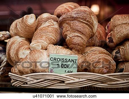 Stock Image - Croissants for sale in bakery. Fotosearch