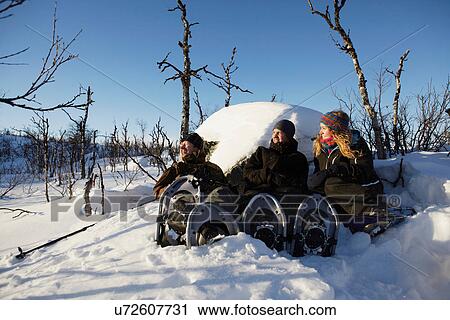 Cross-country skiers resting in snow View Large Photo Image Stock Image - Cross-country skiers resting in snow. Fotosearch