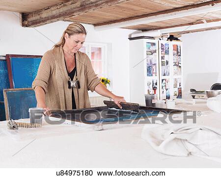 Designer printing on textiles in studio View Large Photo Image Stock Image - Designer printing on textiles in studio. Fotosearch