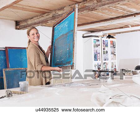 Designer with printing screen in studio View Large Photo Image Stock Photography - Designer with printing screen in studio. Fotosearch