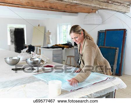 Designer working with textiles in studio View Large Photo Image Stock Photo - Designer working with textiles in studio. Fotosearch