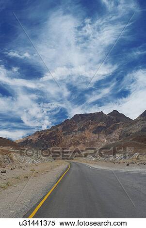 Empty rural road under blue sky View Large Photo Image Stock Photography - Empty rural road under blue sky. Fotosearch