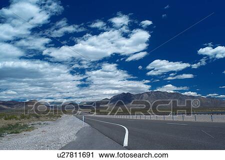 Empty rural road under cloudy sky View Large Photo Image Stock Image - Empty rural road under cloudy sky. Fotosearch