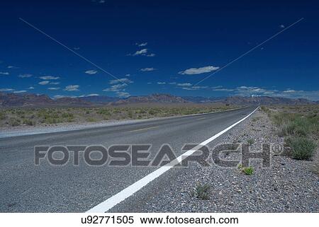 Empty rural road under cloudy sky View Large Photo Image Stock Photography - Empty rural road under cloudy sky. Fotosearch