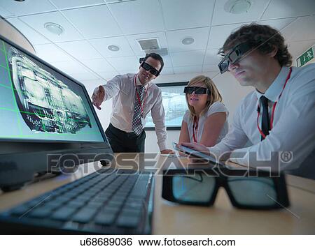 Engineers and apprentice in conference room wearing 3D glasses to look at 3D screens View Large Photo Image Stock Photograph - Engineers and apprentice in conference room wearing 3D glasses to look at 3D screens. Fotosearch