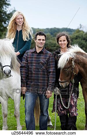 Family walking horses outdoors View Large Photo Image Stock Photograph - Family walking horses outdoors. Fotosearch