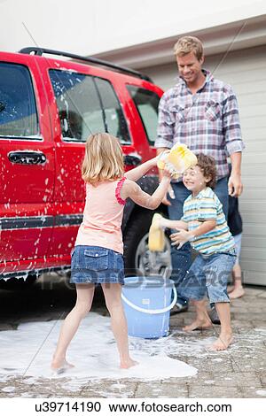 Family washing car together View Large Photo Image Stock Image - Family washing car together. Fotosearch