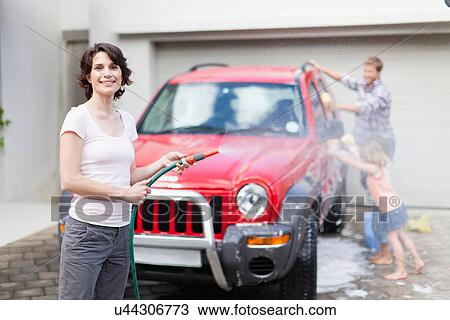 Family washing car together View Large Photo Image Stock Image - Family washing car together. Fotosearch