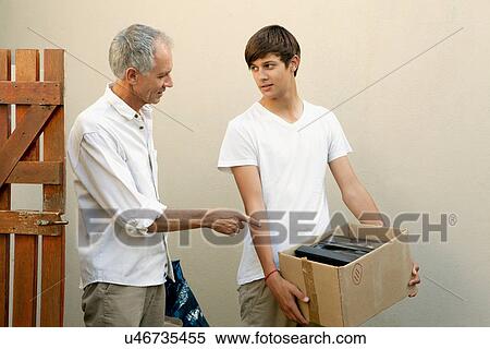 Father and son moving boxes View Large Photo Image Stock Photography - Father and son moving boxes. Fotosearch