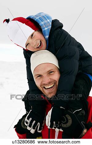 Father carrying son on his shoulders View Large Photo Image Stock Photograph - Father carrying son on his shoulders. Fotosearch
