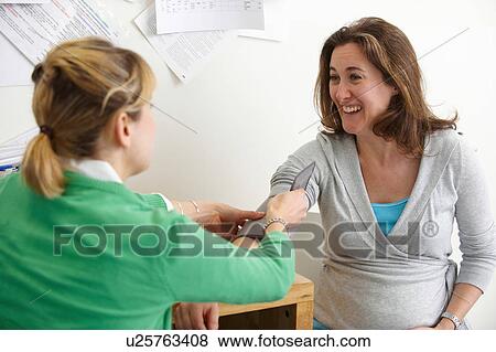 Stock Photo - Female patient with doctor. Fotosearch