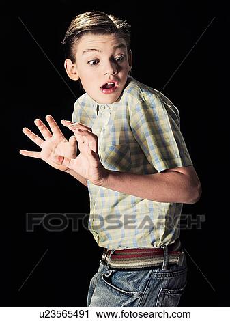 Stock Image - Frightened boy gasping. Fotosearch