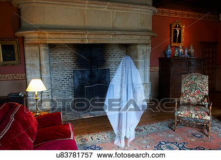 Stock Photo - Ghost floating in ornate living room. Fotosearch