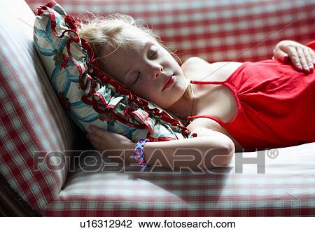 Girl napping on couch View Large Photo Image Stock Image - Girl napping on couch. Fotosearch
