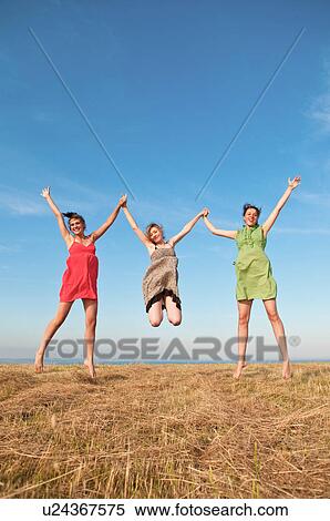 Girls playing in wheat field View Large Photo Image Stock Photography - Girls playing in wheat field. Fotosearch