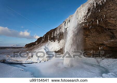 Glacial waterfall pouring into ice View Large Photo Image Stock Image - Glacial waterfall pouring into ice. Fotosearch