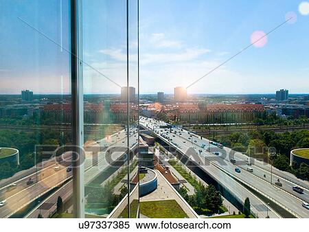 Stock Photography - Glass building overlooking city center. Fotosearch