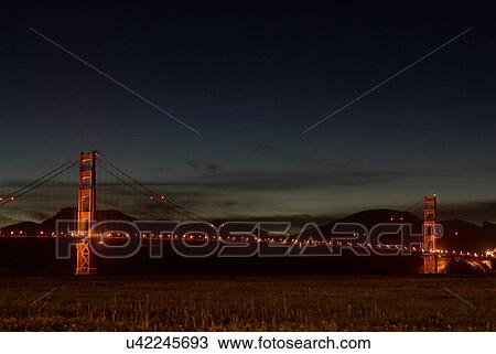 Golden Gate Bridge lit up at night View Large Photo Image Stock Image - Golden Gate Bridge lit up at night. Fotosearch