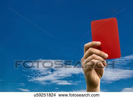 Hand holding red card against blue sky View Large Photo Image Picture - Hand holding red card against blue sky. Fotosearch