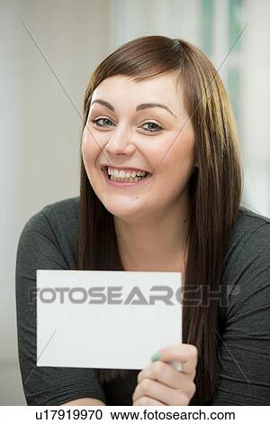 Happy young woman with a blank card View Large Photo Image Stock Image - Happy young woman with a blank card. Fotosearch