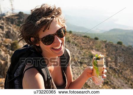 Hiker eating sandwich on hill View Large Photo Image Stock Photography - Hiker eating sandwich on hill. Fotosearch