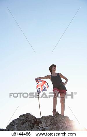 Hiker planting Union Jack flag View Large Photo Image Stock Image - Hiker planting Union Jack flag. Fotosearch