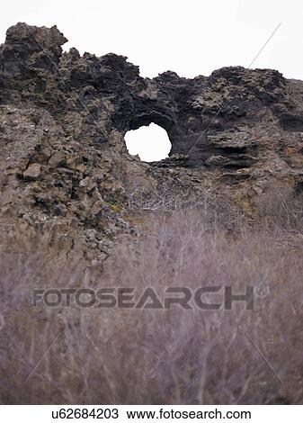 Hole in rural rock formation View Large Photo Image Stock Image - Hole in rural rock formation. Fotosearch